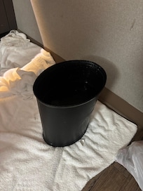Water coming from AC unit in trash can