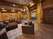 Another area of the Lobby close to the front desk. There is coffee in the Lobby all day.