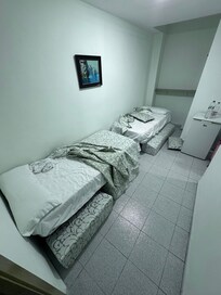 This is what the second room actually looks like. No window, stains on bedding and mold on the edges.