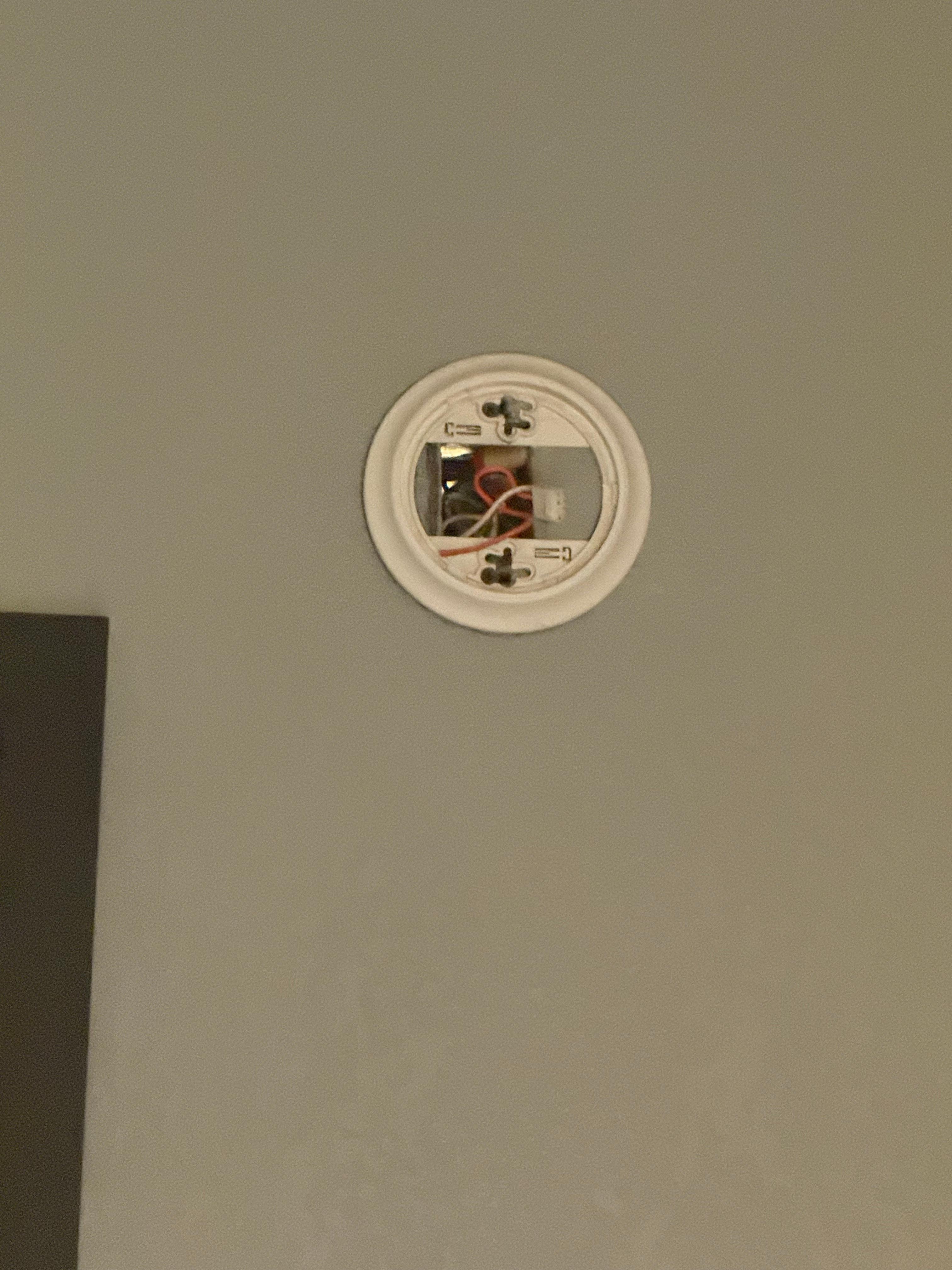 Smoke alarm reminded from wall