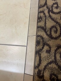 Doorway tile loose.