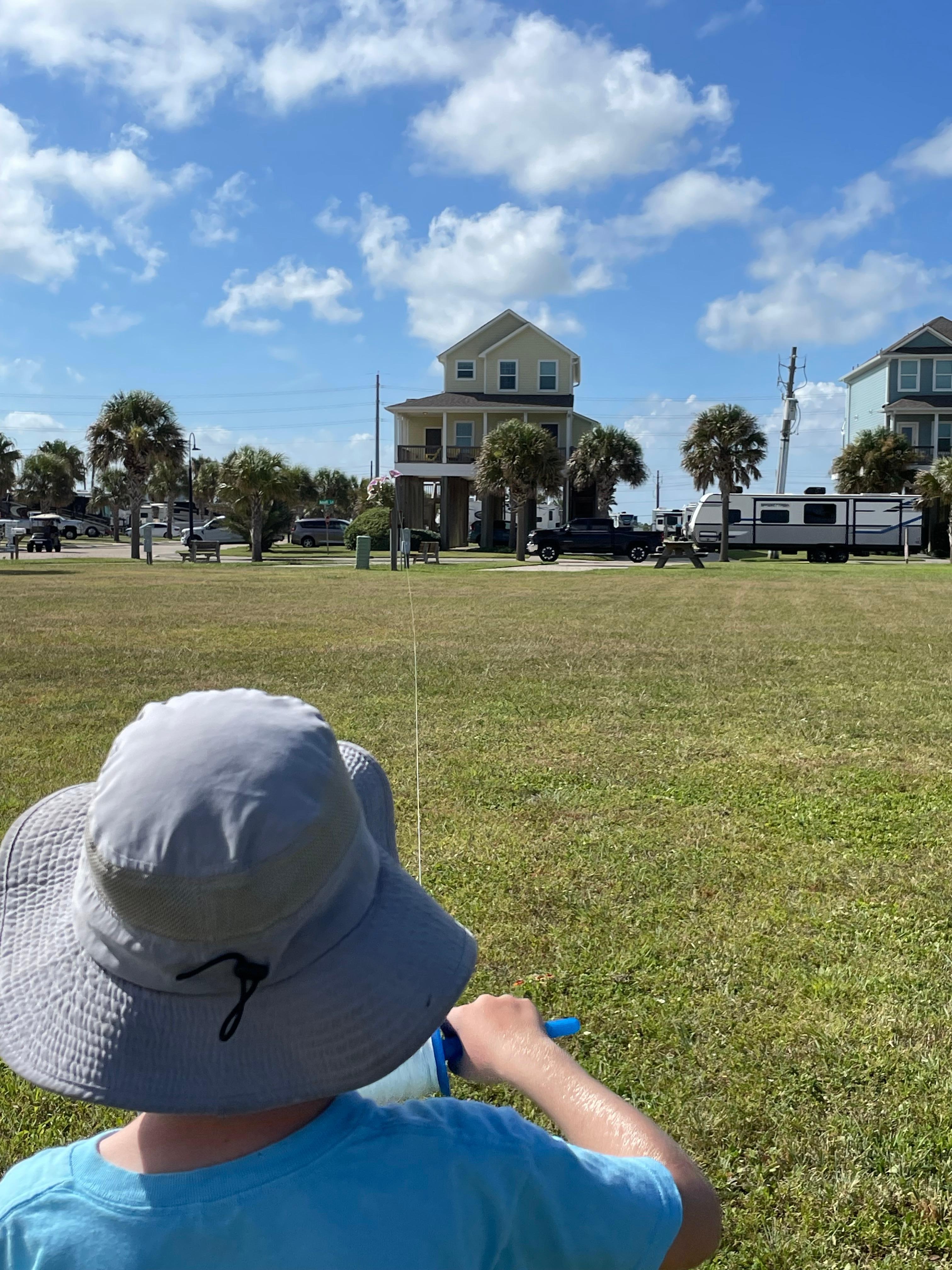 The beach house is in the background. 