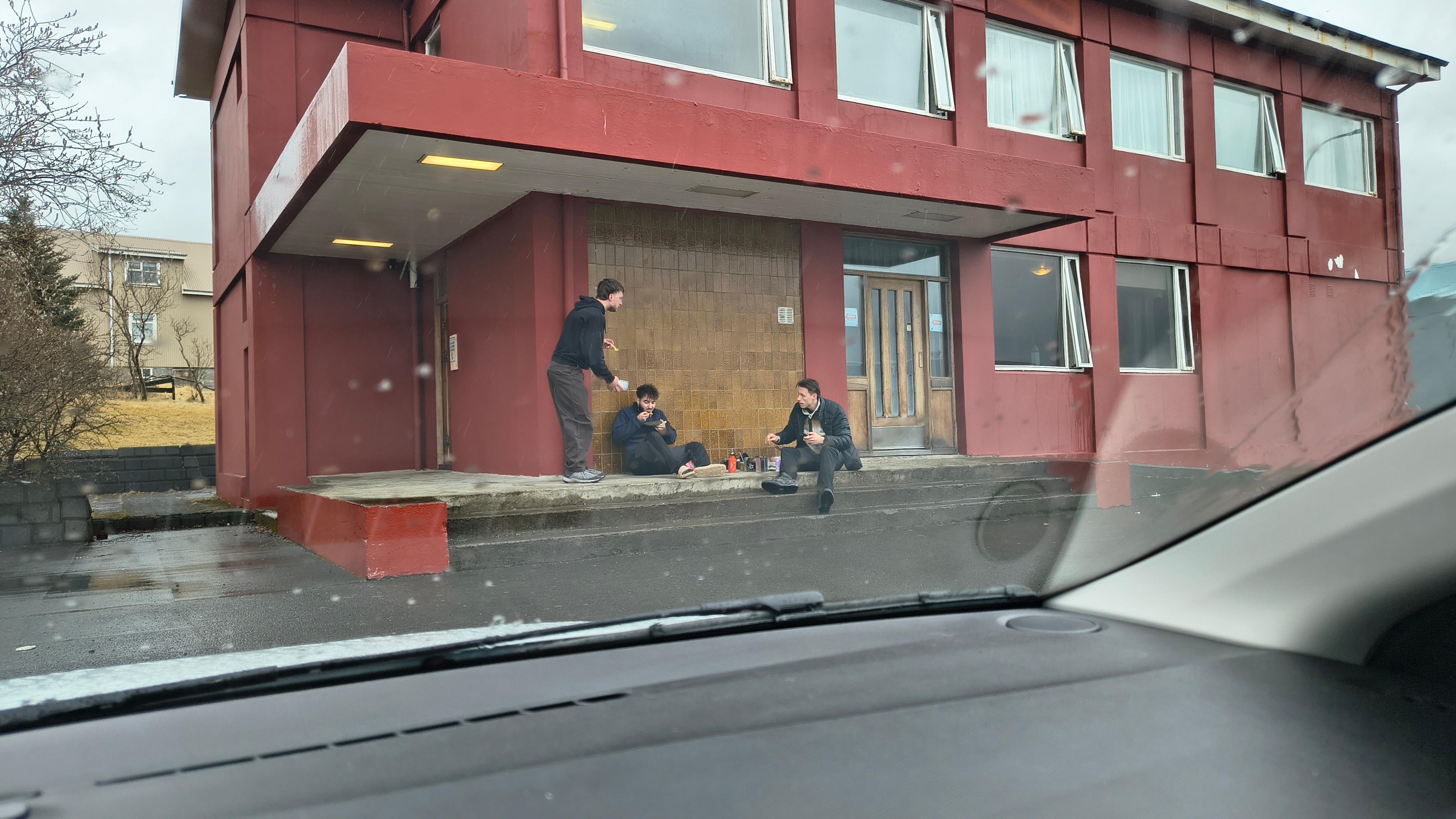 People cooking breakfast outside the 'hotel'