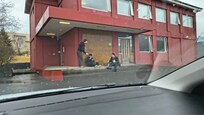 People cooking breakfast outside the 'hotel'