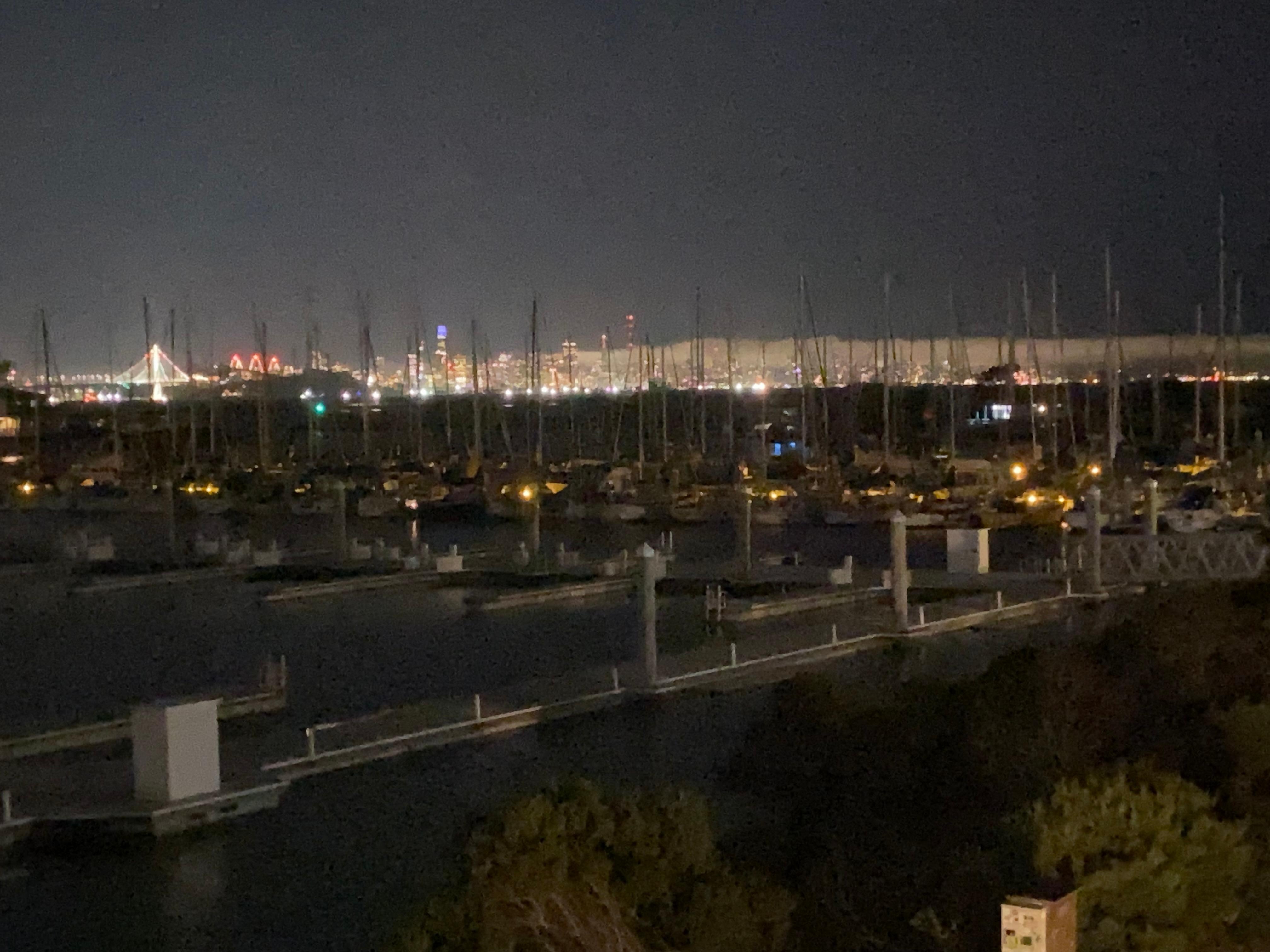Night view of Berkeley marina and San Francisco beyond