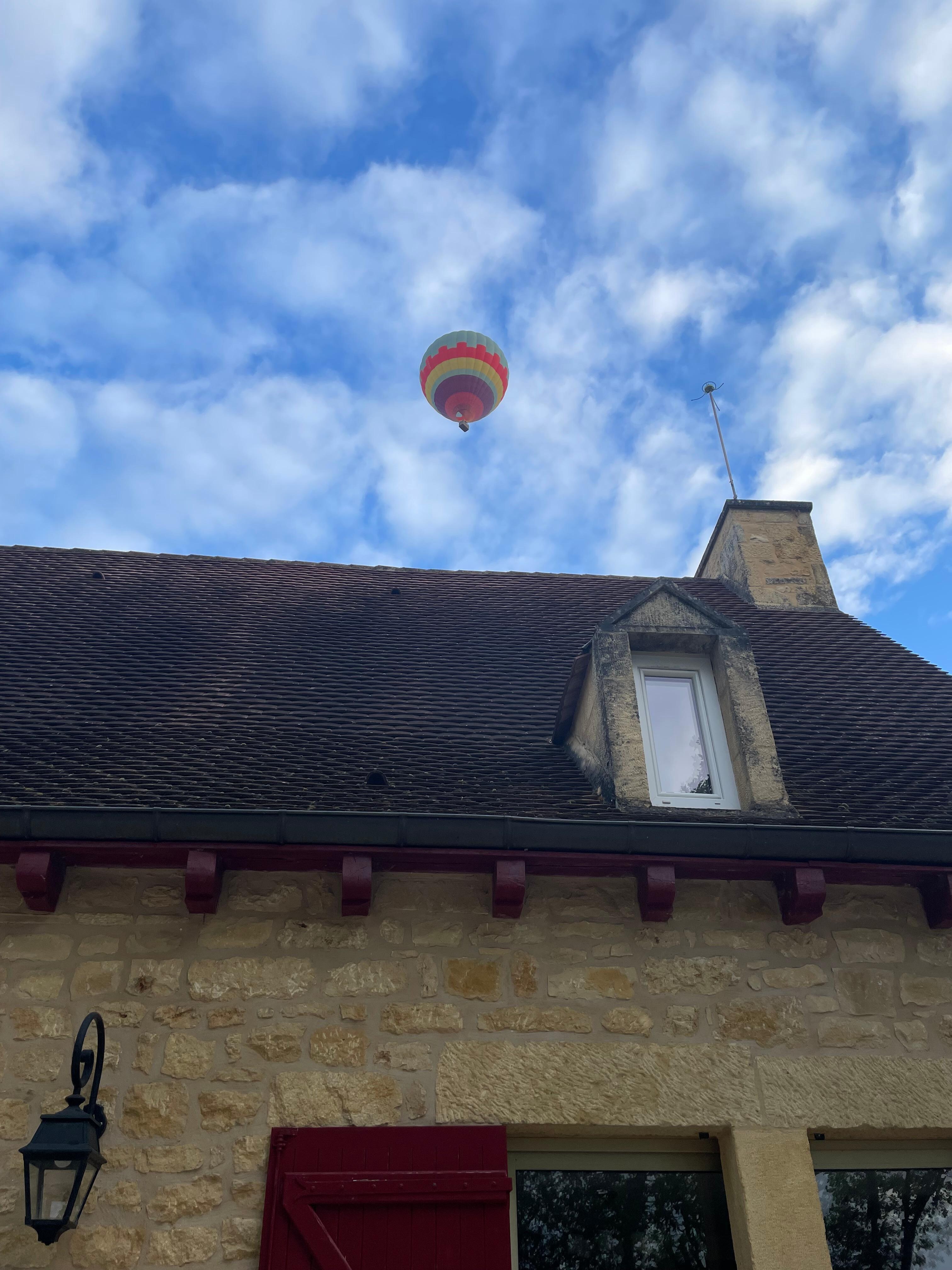 Hot air balloon above the house