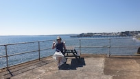 Picnic tables at the water's edge with the sound of the waves rolling in. Mmmm.