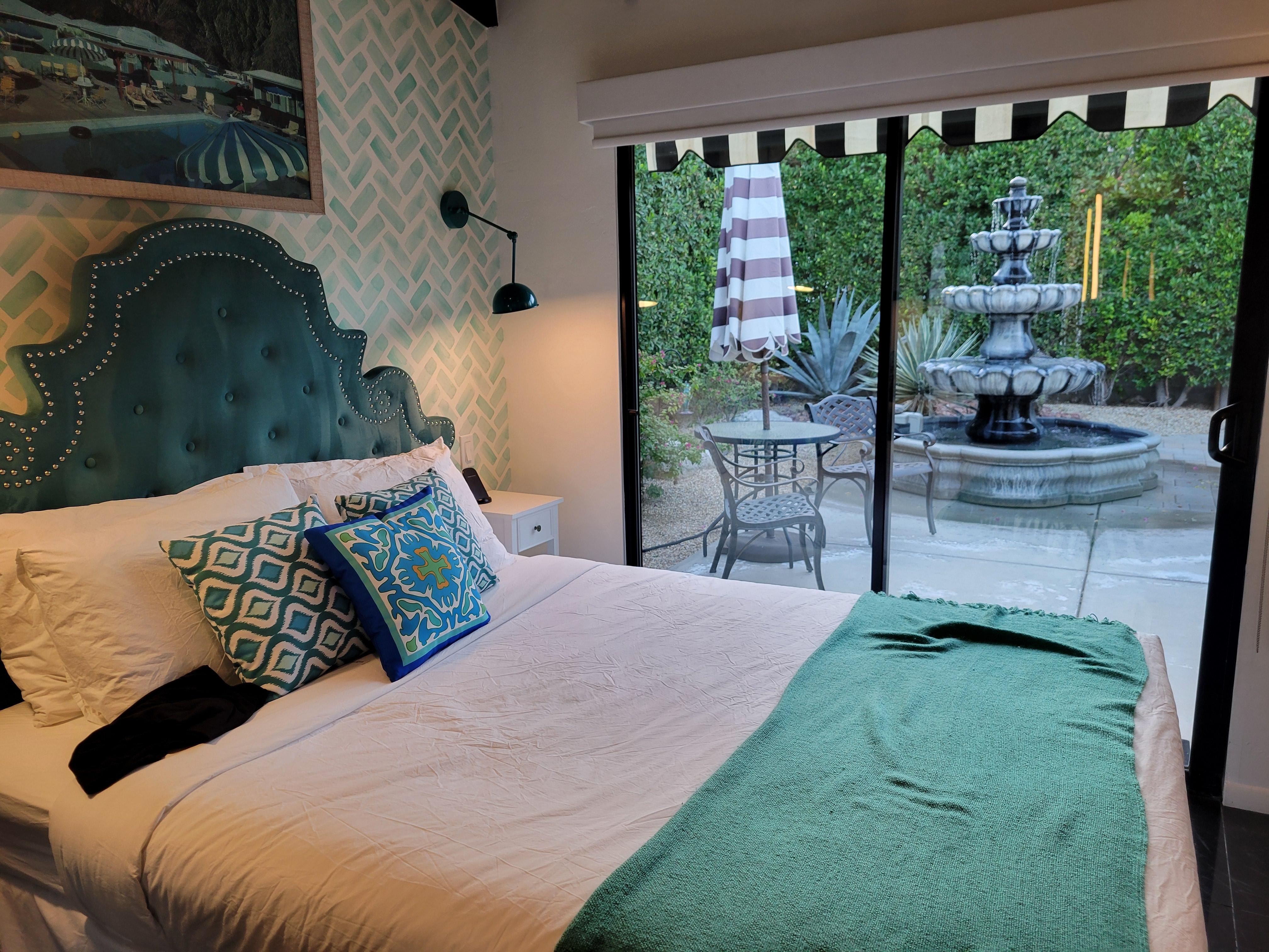 One bedroom in the house with view of peaceful courtyard and lovely fountain 