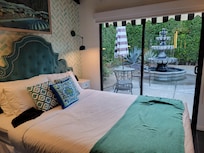 One bedroom in the house with view of peaceful courtyard and lovely fountain