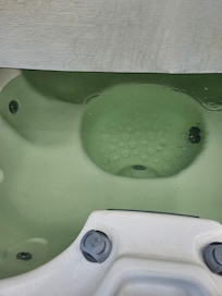 Green hot tub water that we were told is normal for city water color… smh