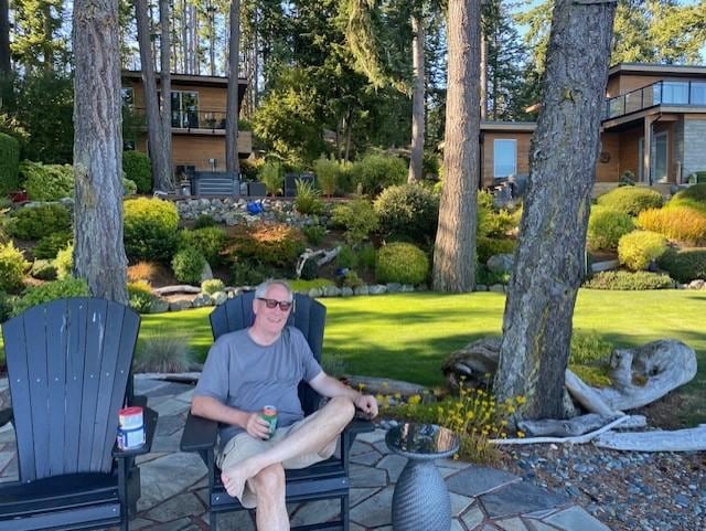 View from the water looking up at the cottage on the left and main house on the right.