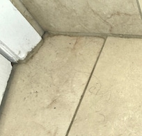 Dirty bathroom floor wirh hair