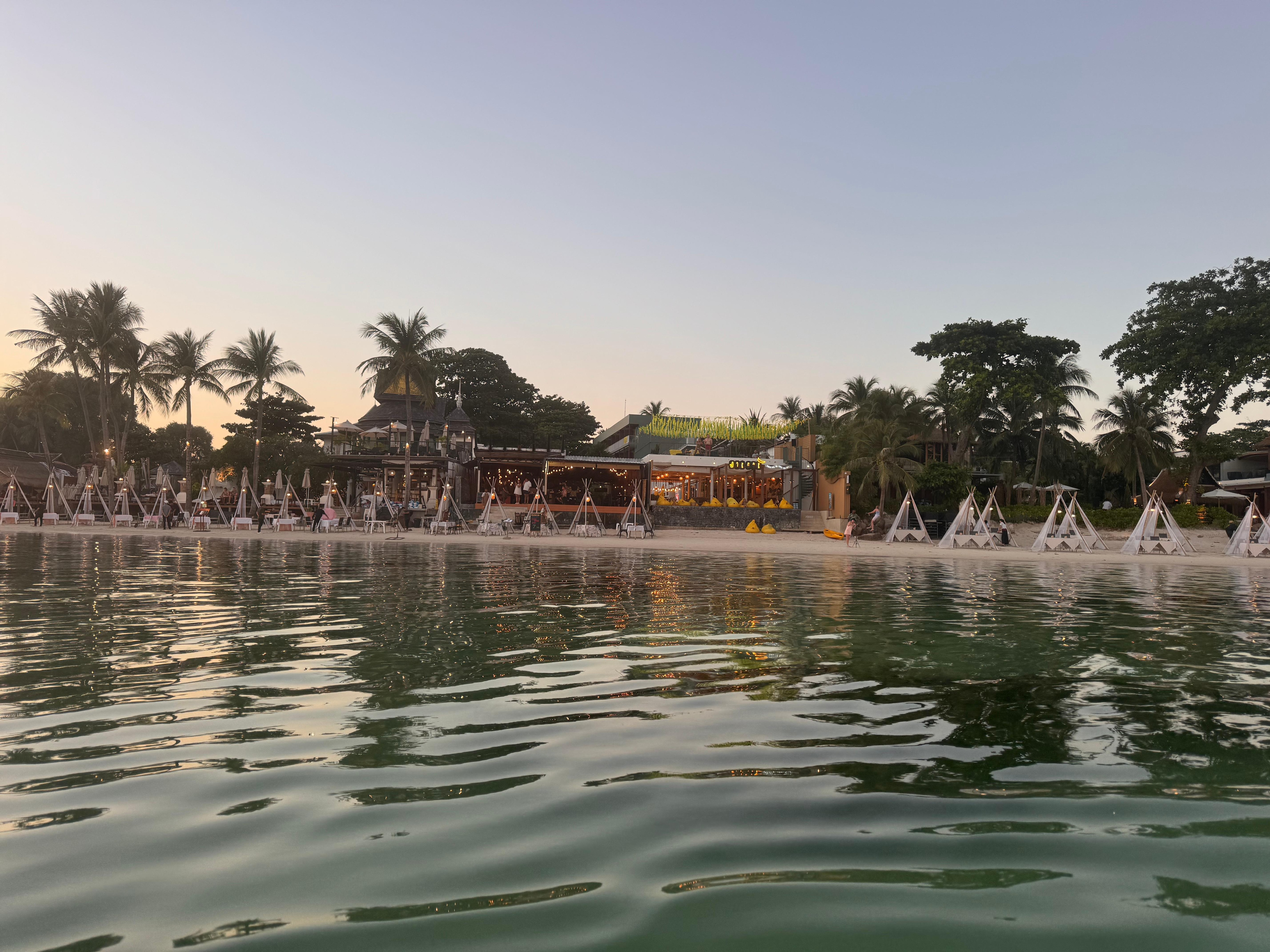 View of the beach and hotel from the water. 
