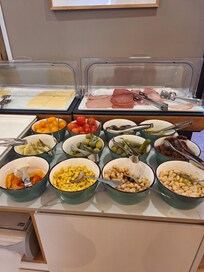 Some cold options but did include hot eggs, bacon and sausage and full coffee bar