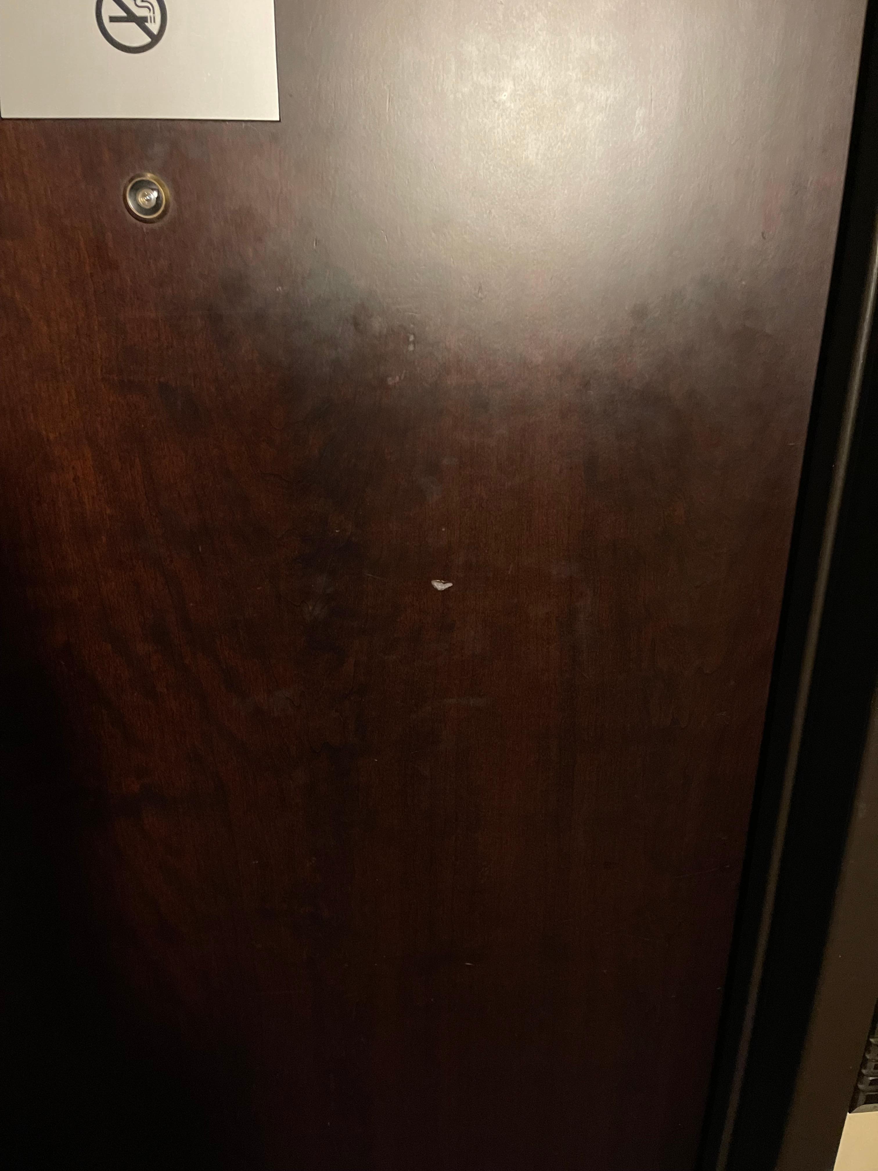 Picture of the dent in the door from the rock that was thrown at our door 