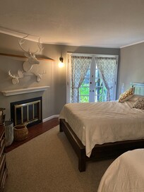 Lovely bedroom with comfy beds and log fire for cosy evenings
