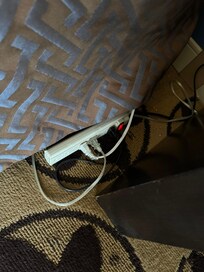 Extension cords on side of bed