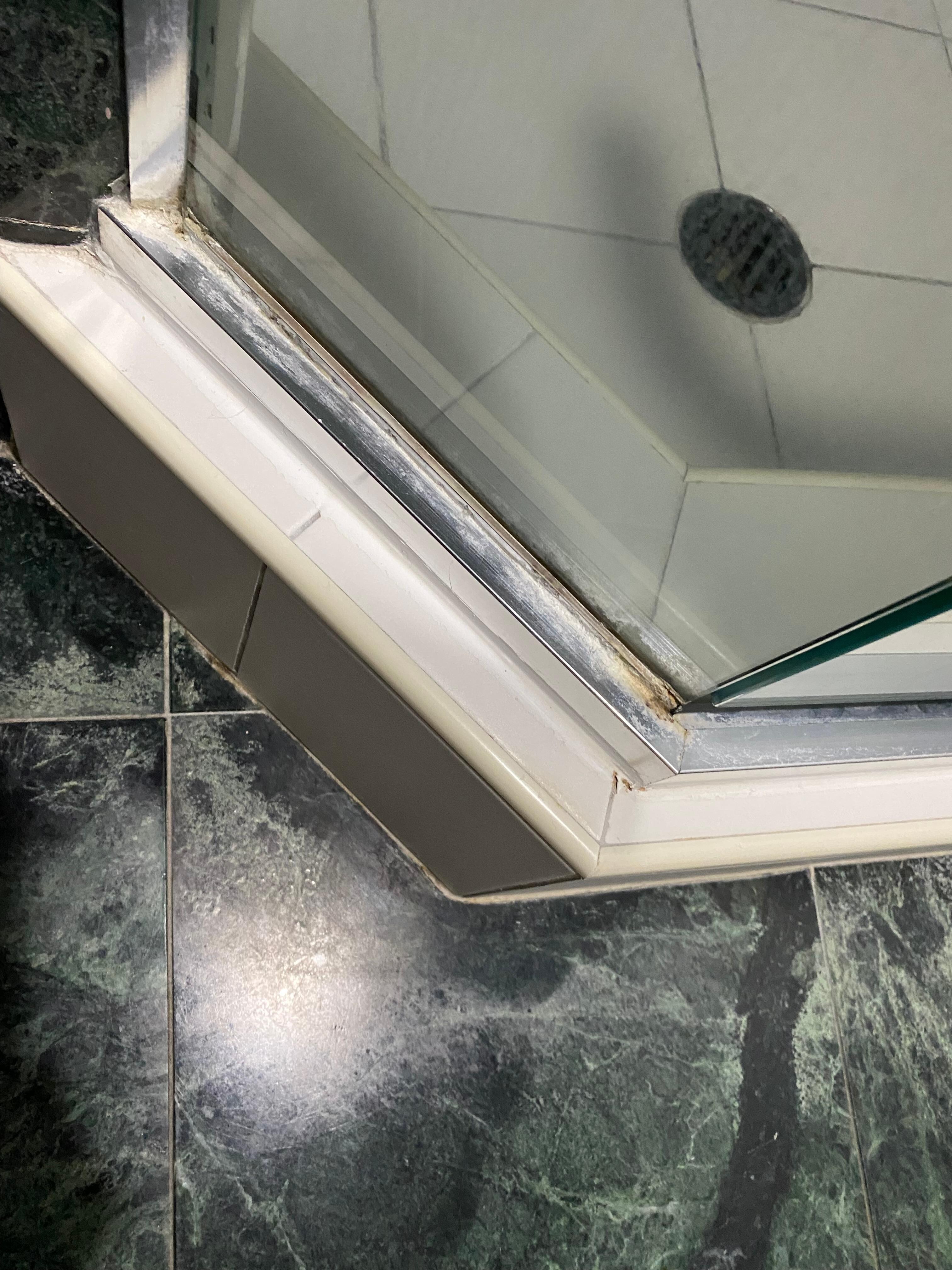 Shower trim was stained and dirty Shower glass was streaky.  