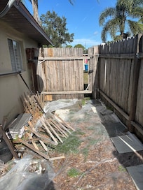 Trash and broken gate