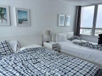 Two queen size bed with a view of the city