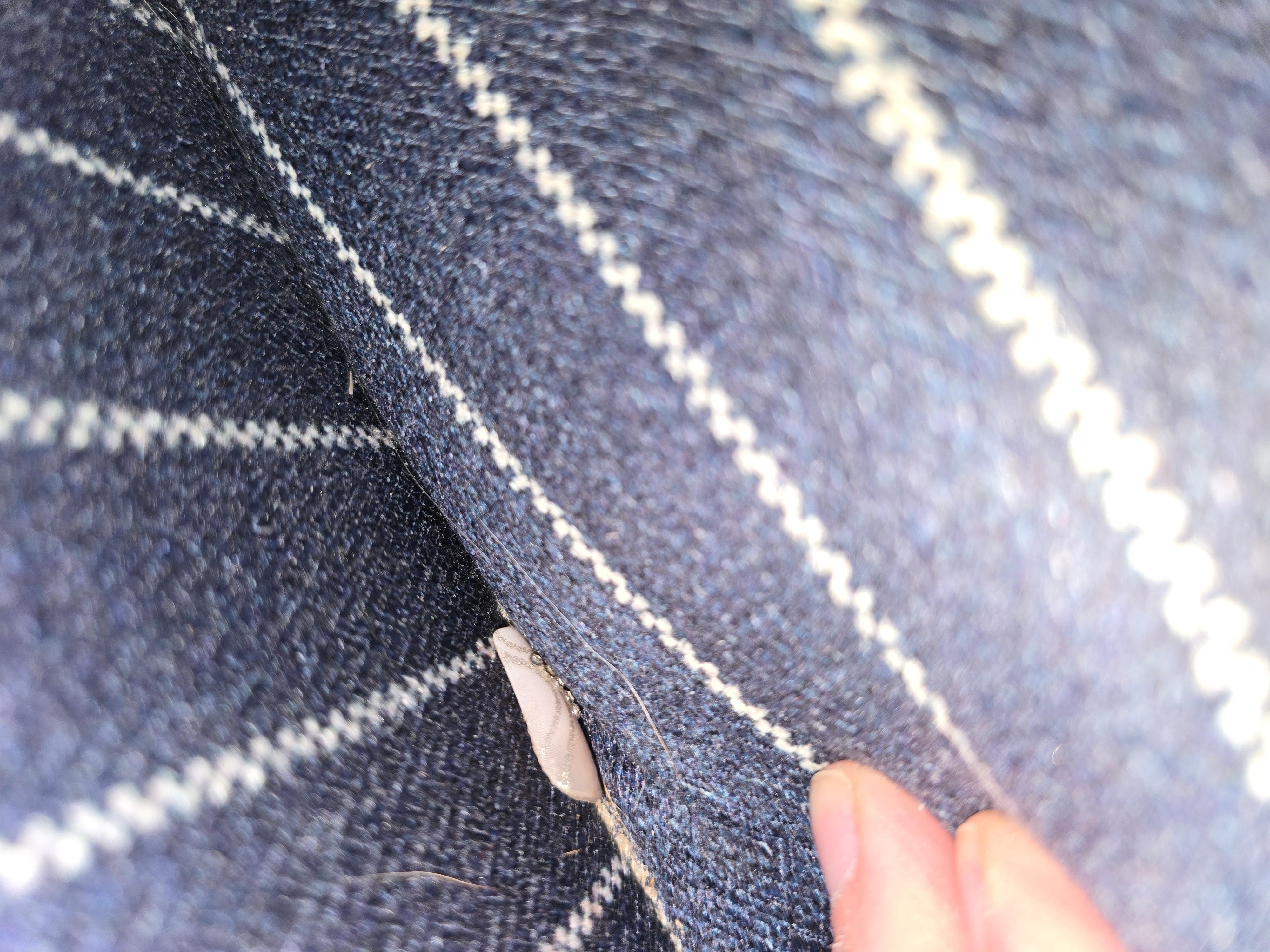 Press on nail from previous tenant left on chair