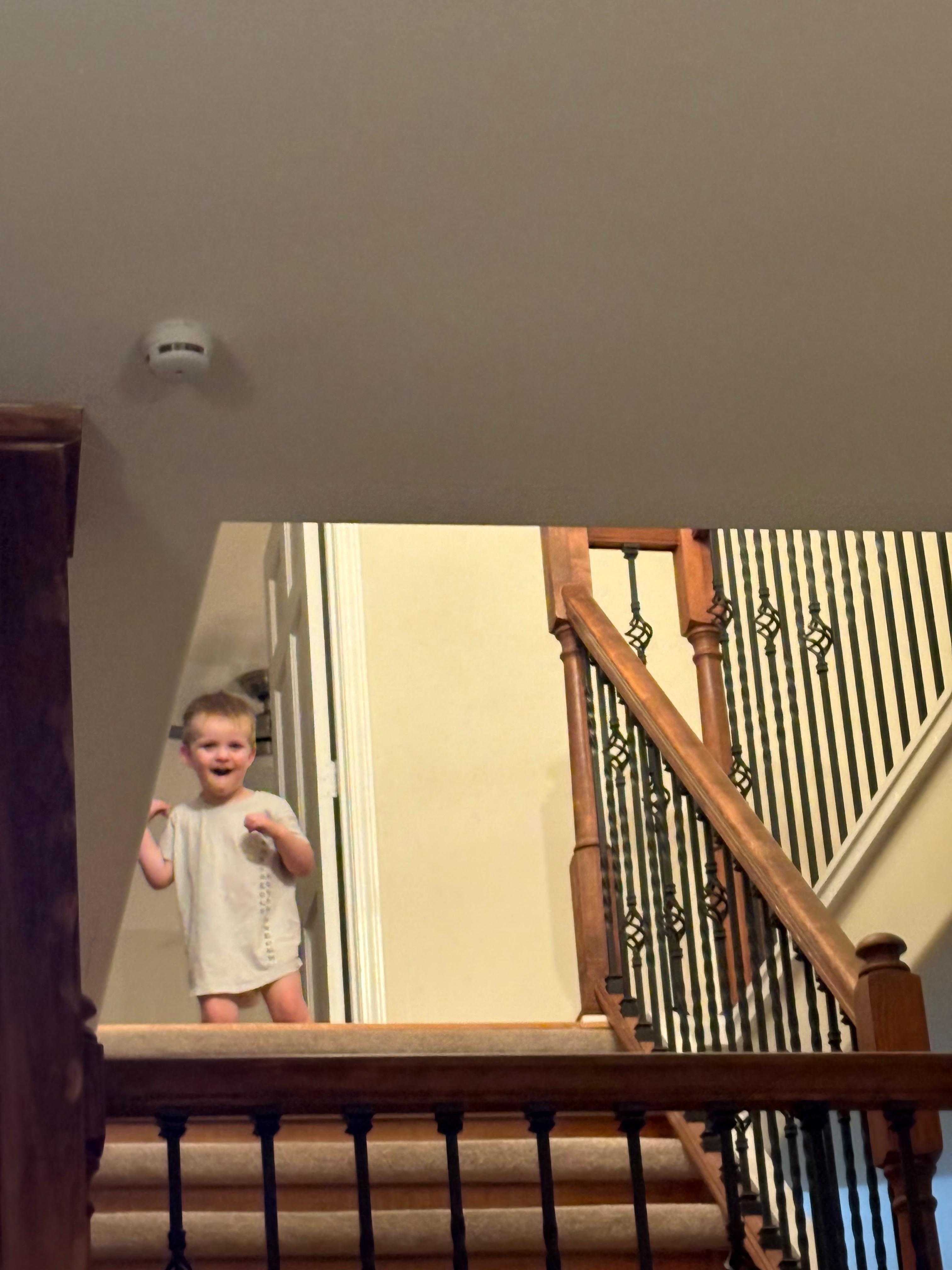 only photo I took inside the Lakeshore property was my grandson at the top of the stairs going up to the third level.  