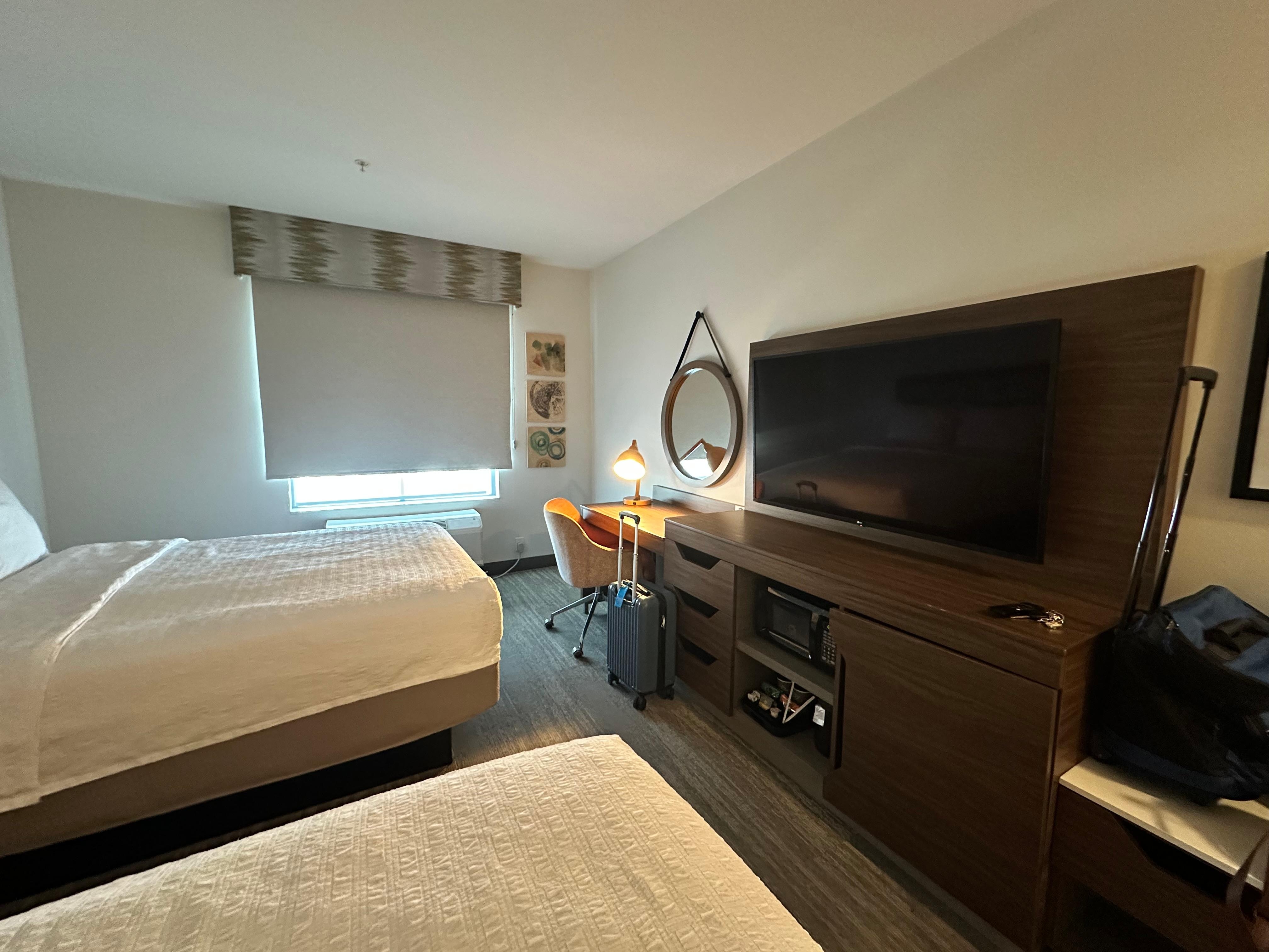 Tv and entertainment area with hidden fridge and microwave