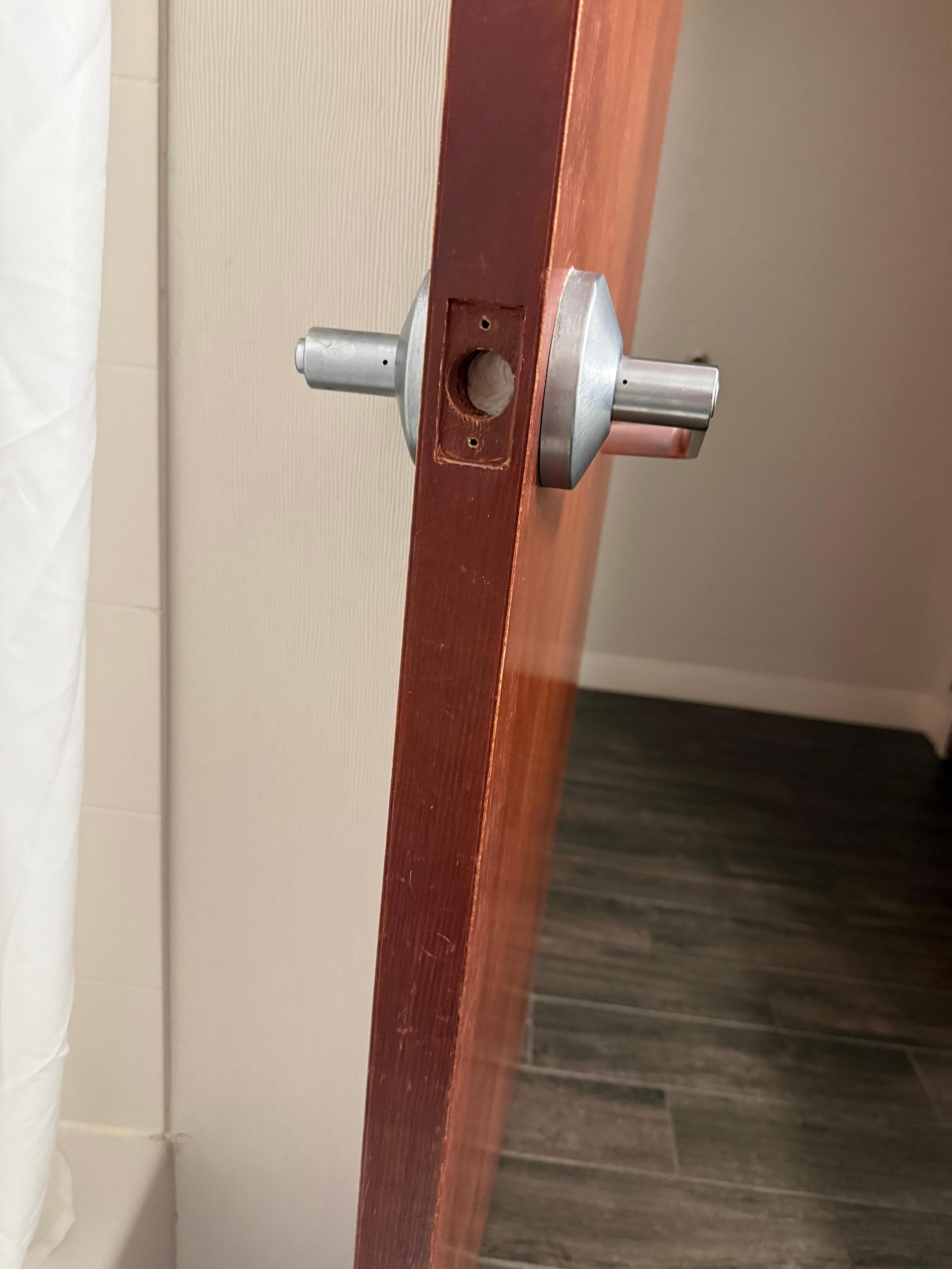 Bathroom door with no latch and paper towel stuffed inside!!! Who does this?!!!!!!