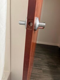 Bathroom door with no latch and paper towel stuffed inside!!! Who does this?!!!!!!