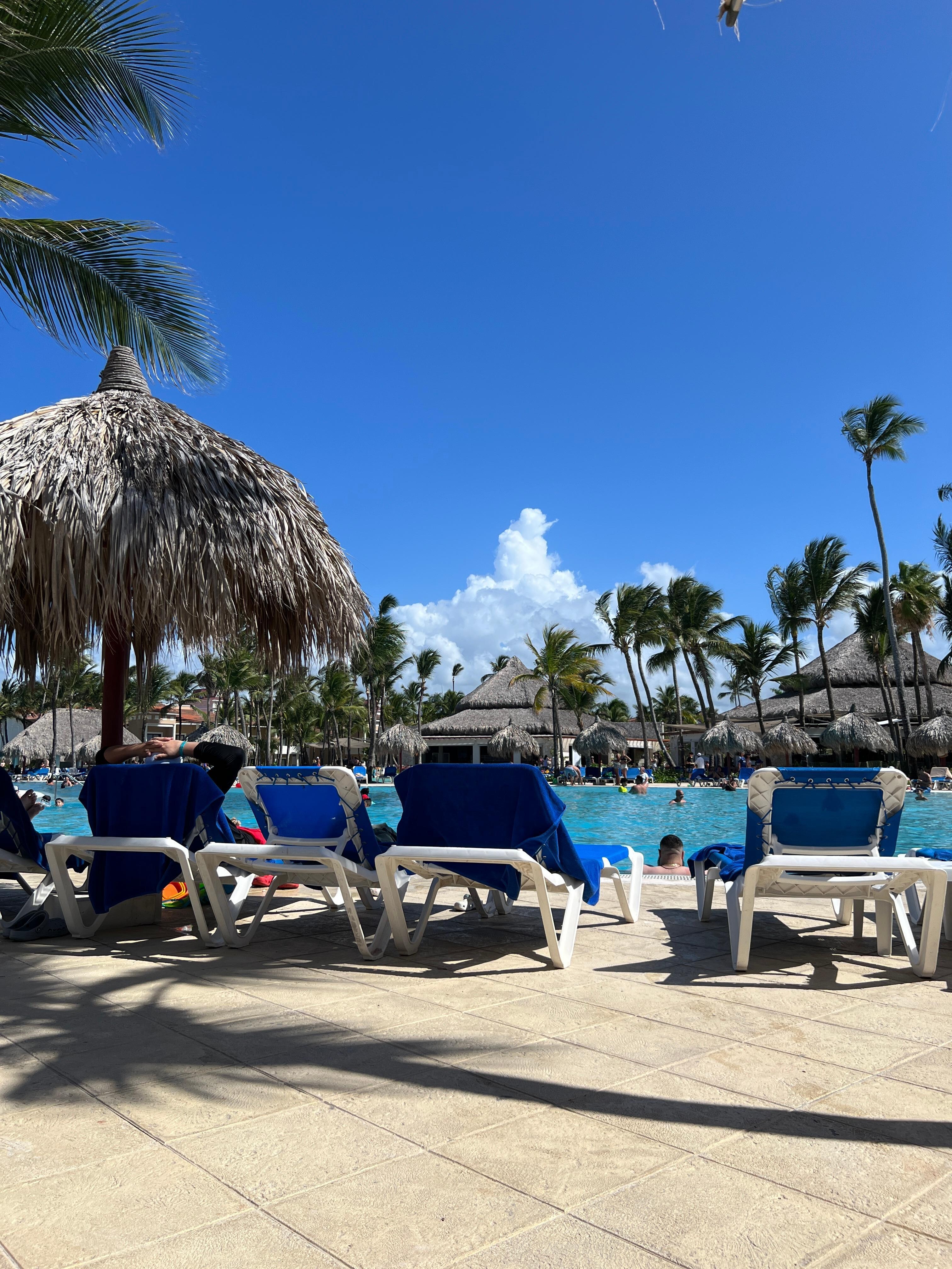 By one of the many pools. St this pool they always have activities and raffle authentic rum. 