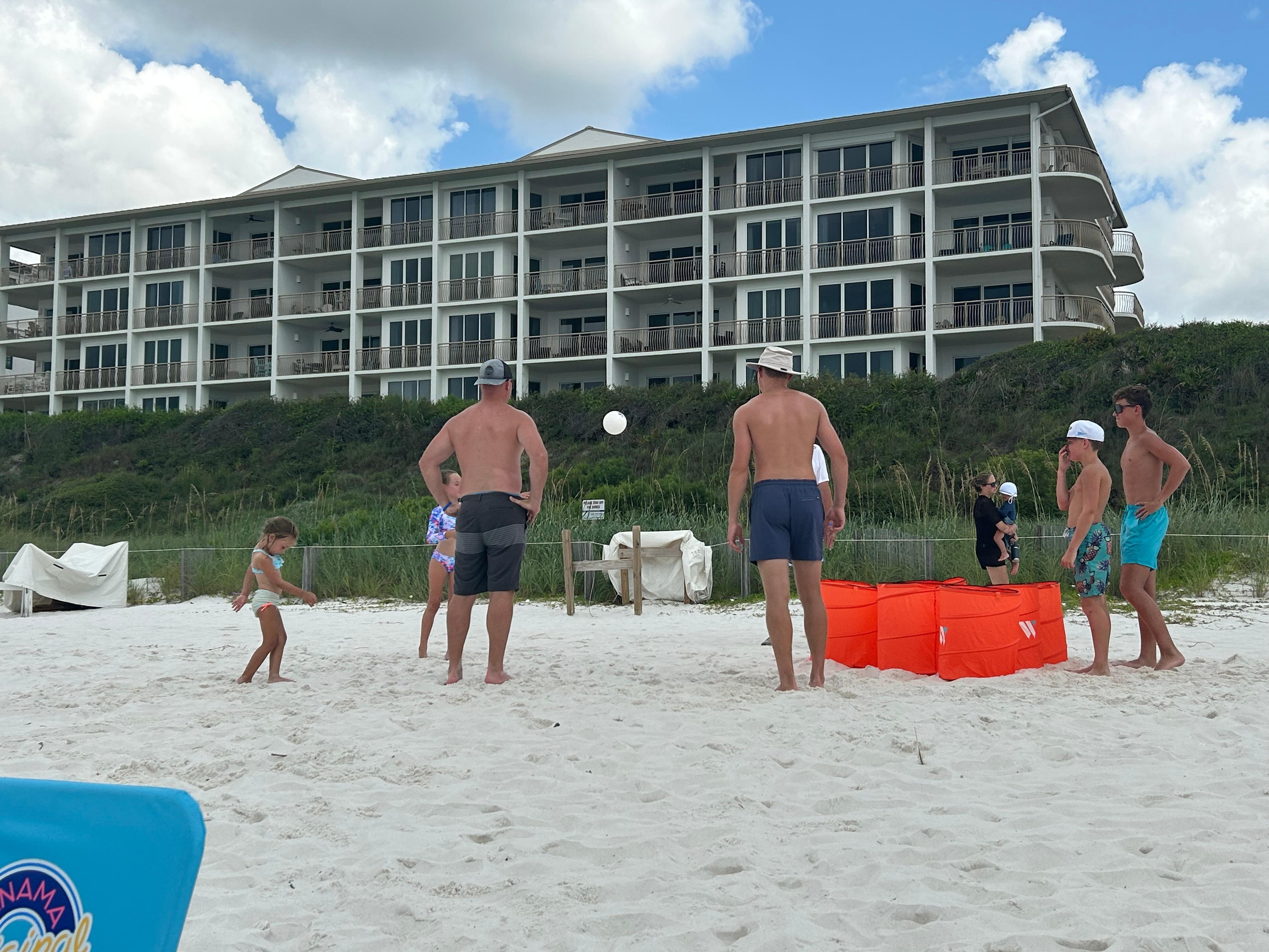 Family playing game on beach