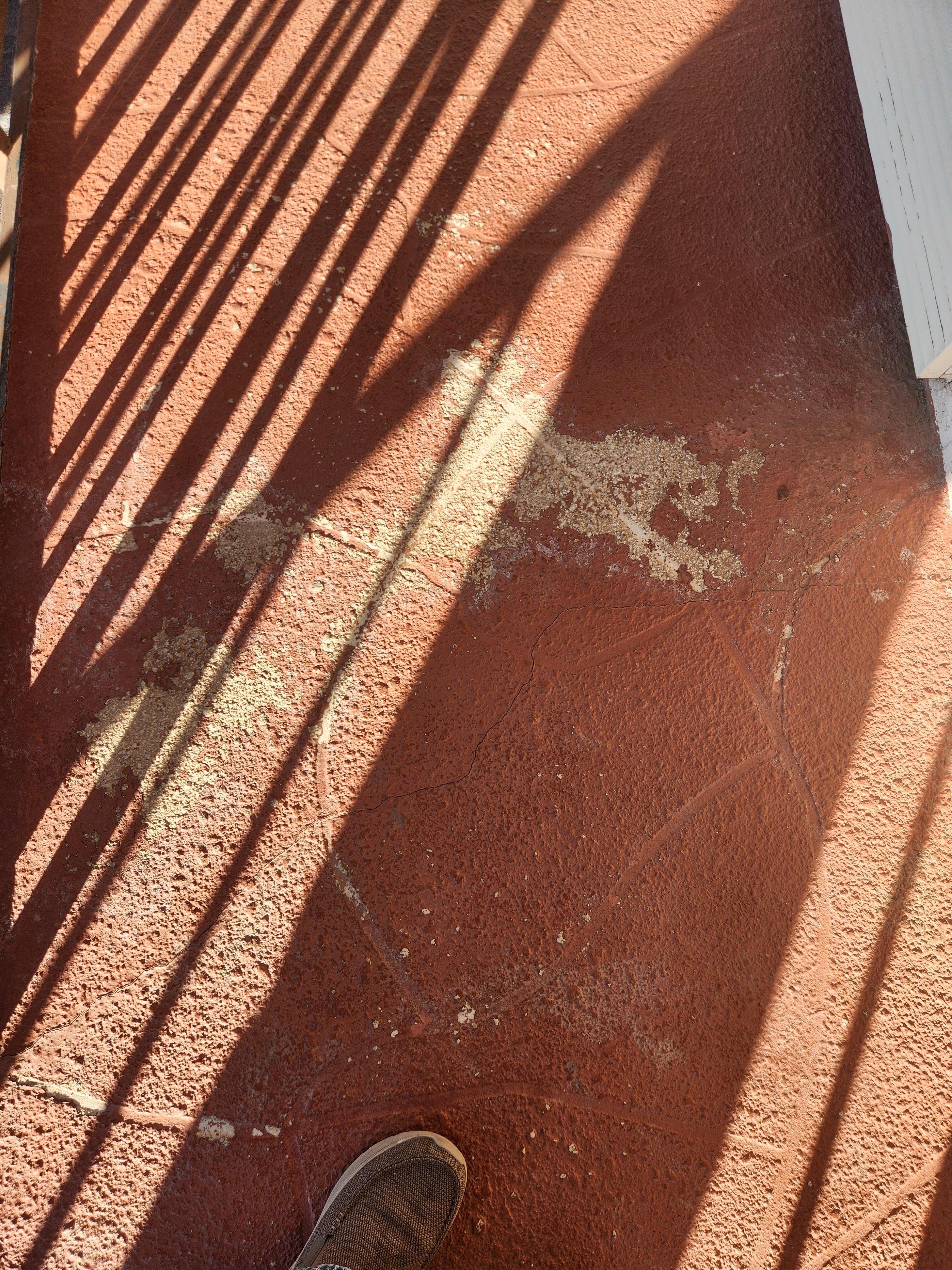 Outside walkway needs painting.