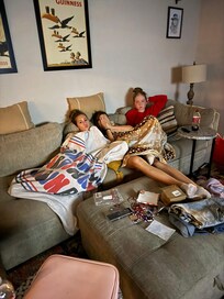 After the concert these girls curled up to enjoy a scary movie.