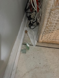 Behind a chair in living room.