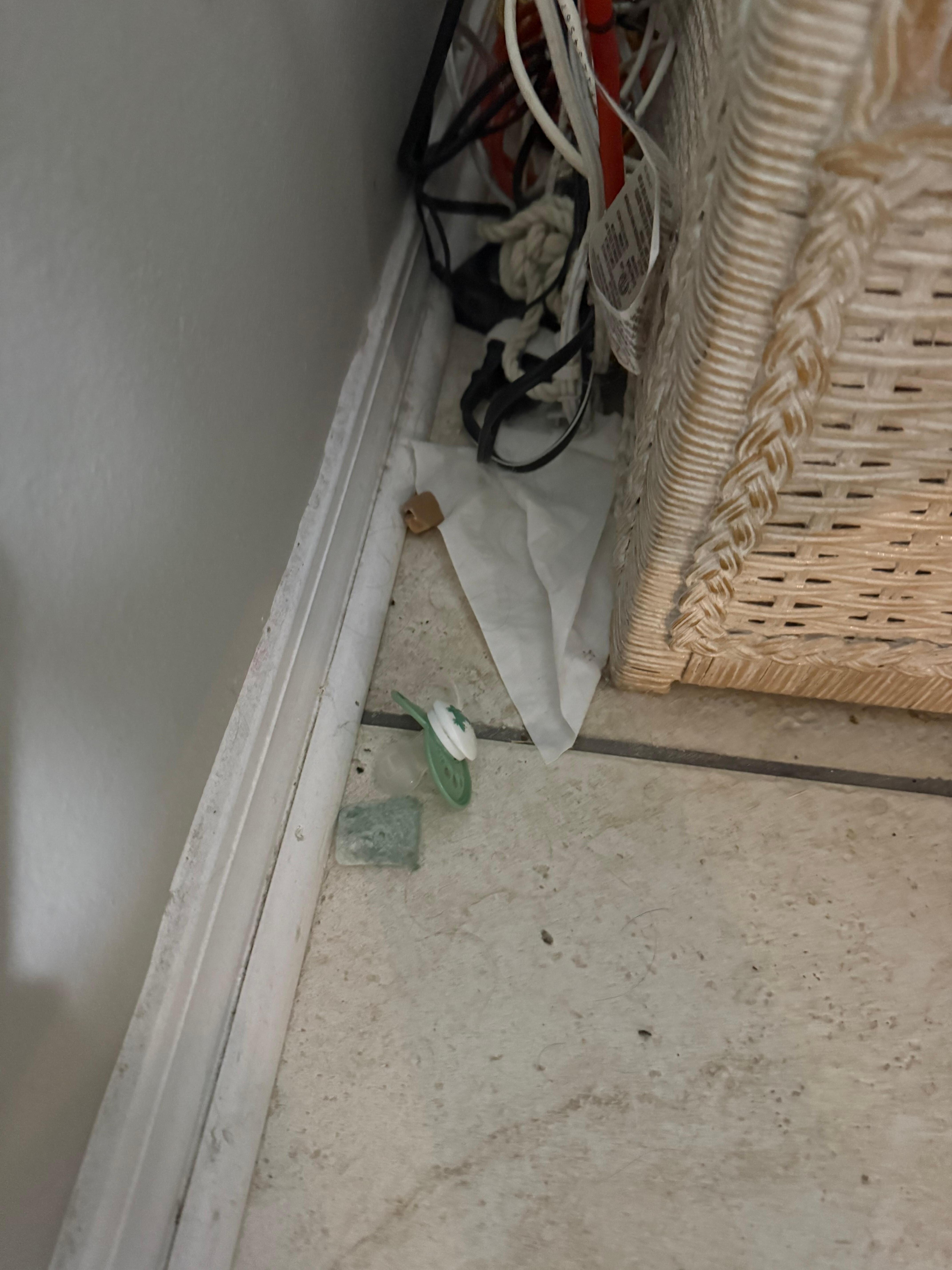 Behind a chair in living room. 