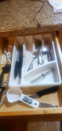Dirty silver ware in drawer