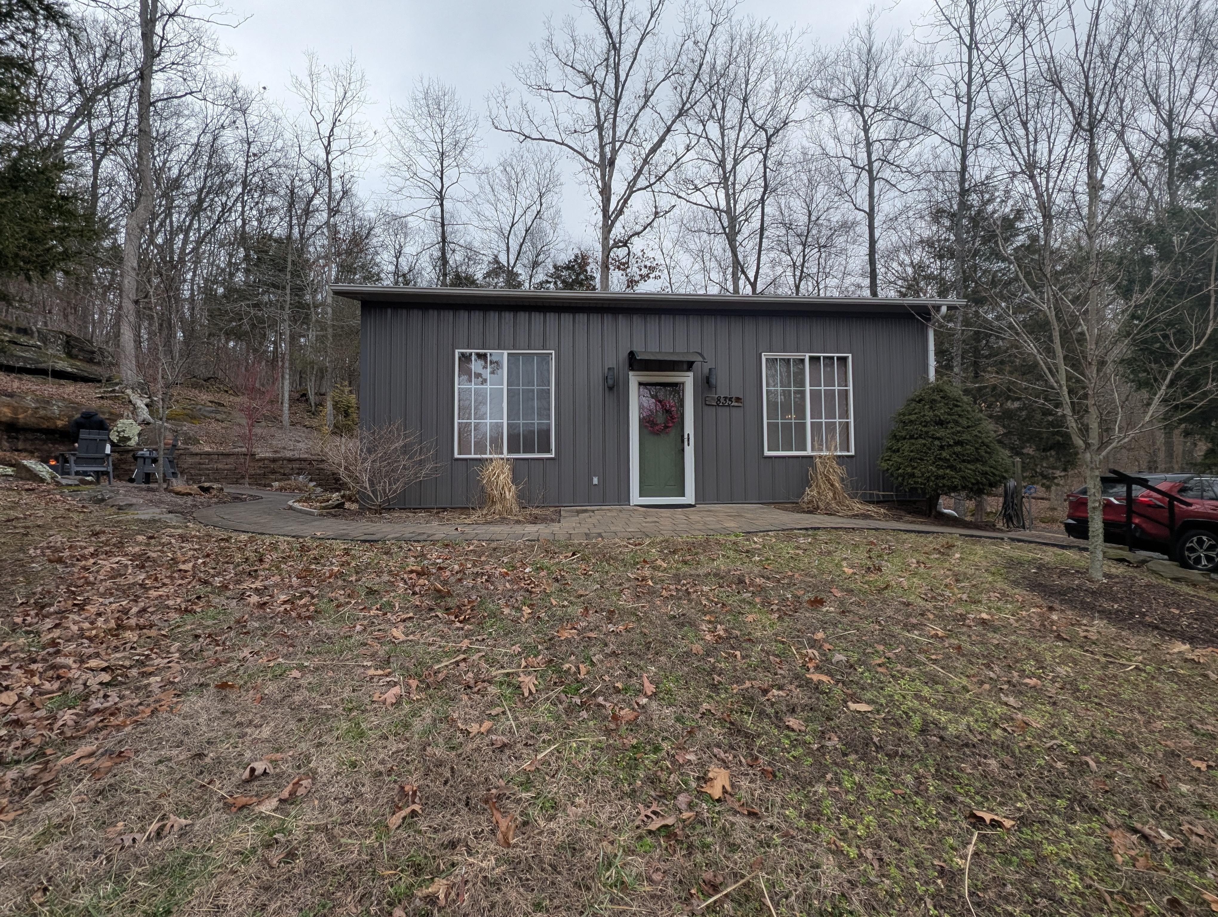 The front of the cabin, with the fire pit off to the left