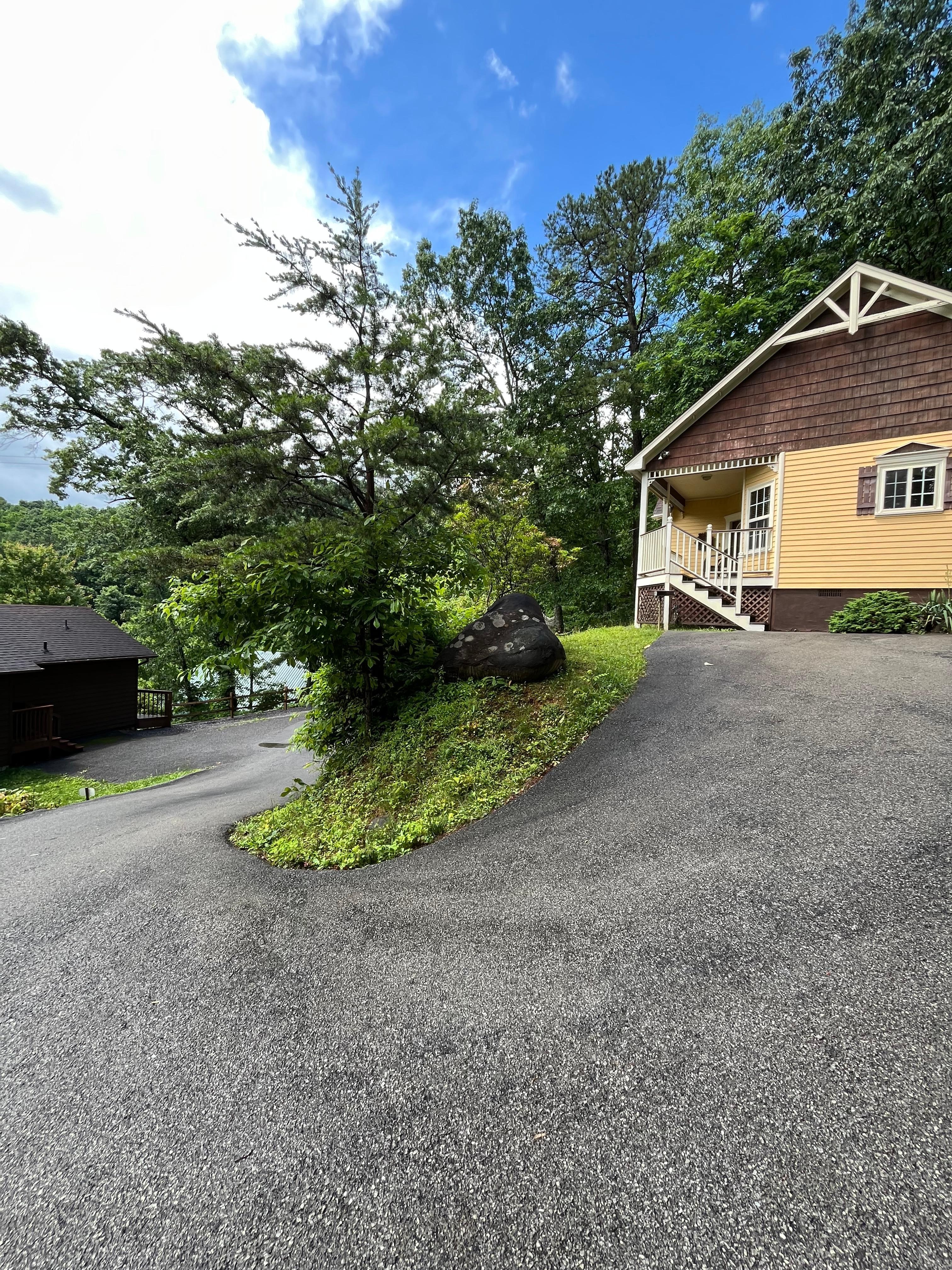 Steep and sharp turn on private driveway to park. 