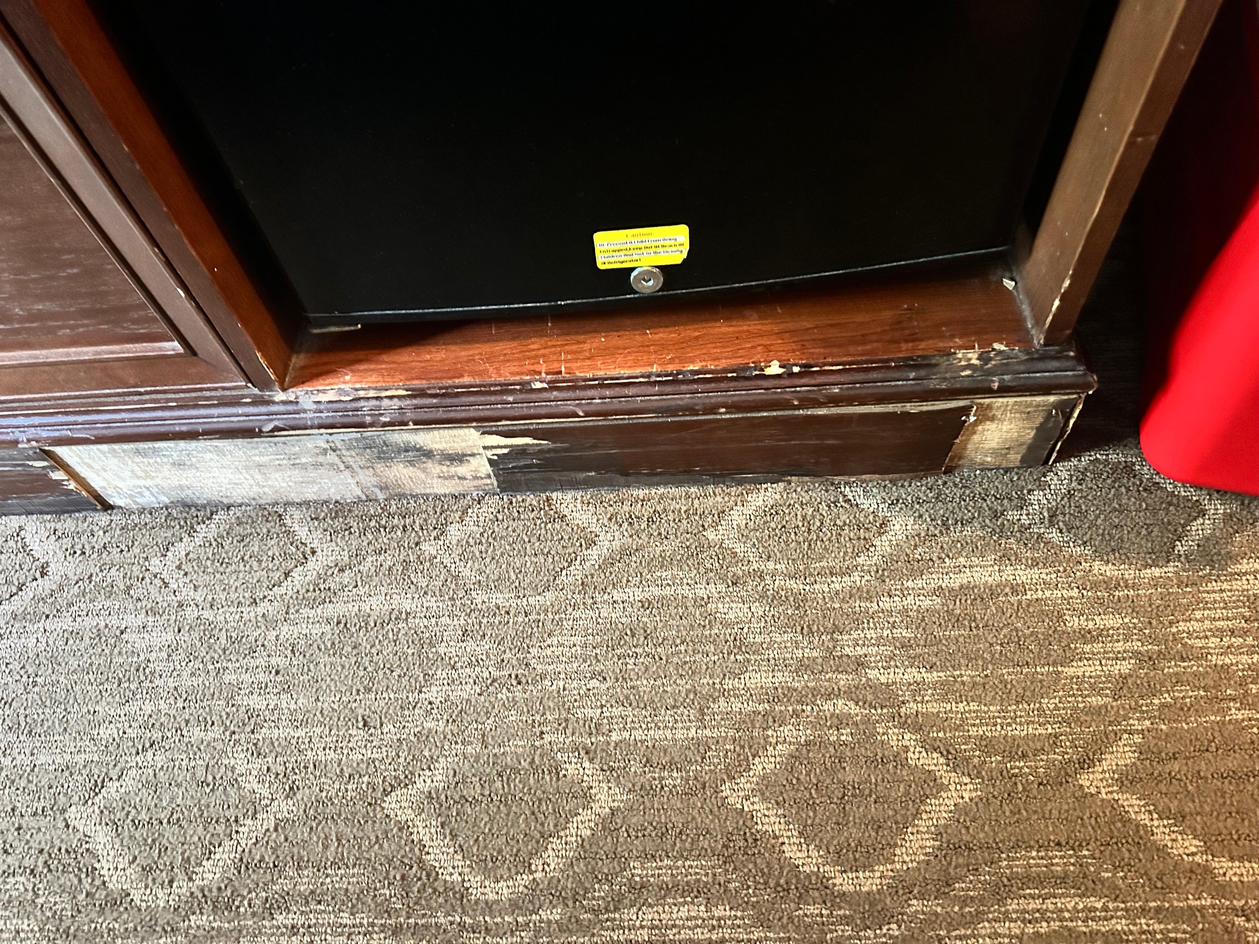 Paneling missing around mini fridge