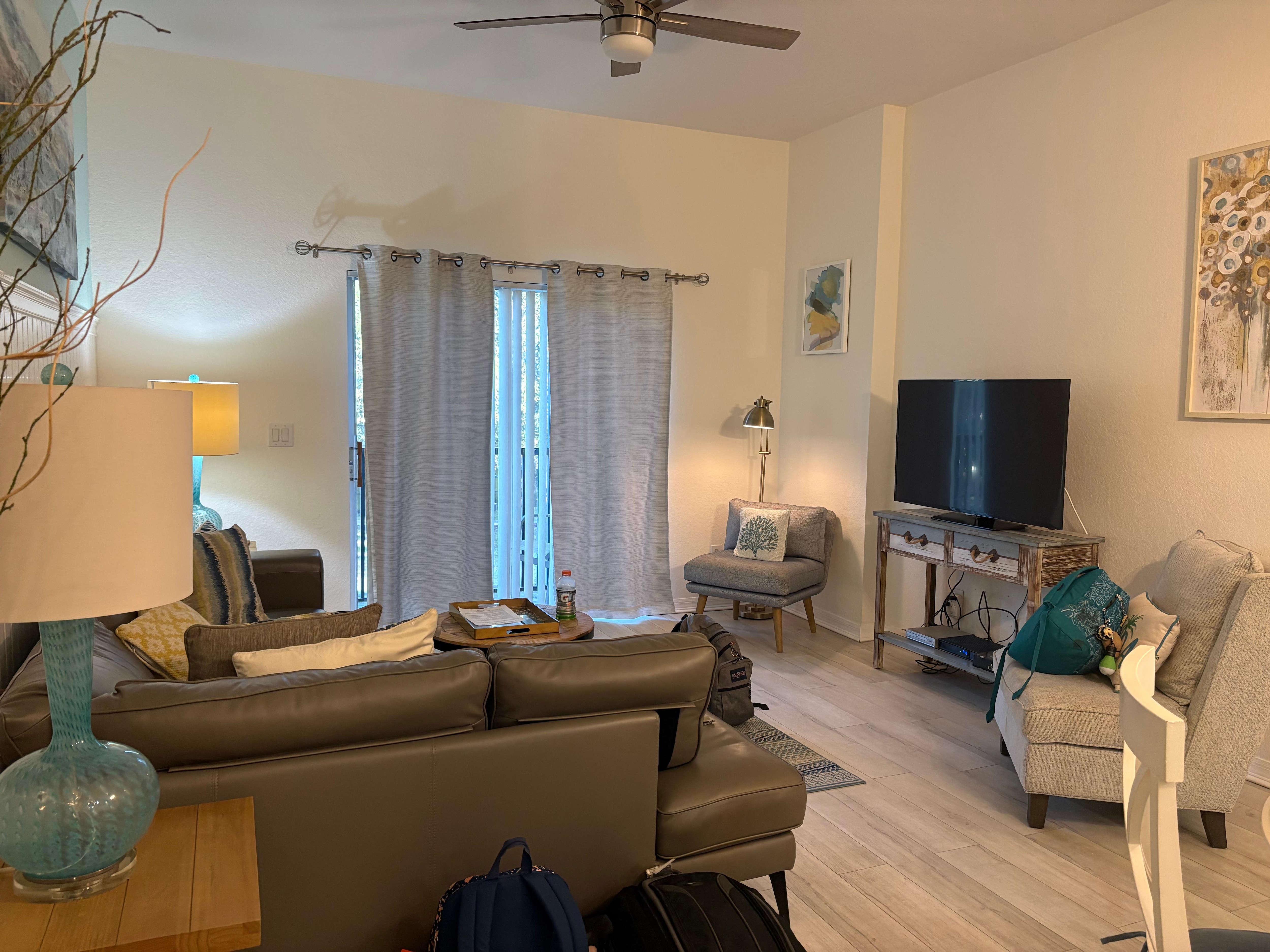 Living room was clean, comfortable, and well-lit.