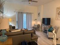 Living room was clean, comfortable, and well-lit.