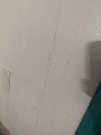 Mildew running down wall from a/c unit