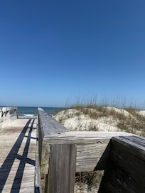 Private boardwalk from the condo pool to beach