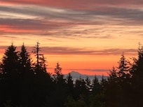 Amazing sunrise views with wall of windows in the living room. Mountains and distant ocean views change throughout the day