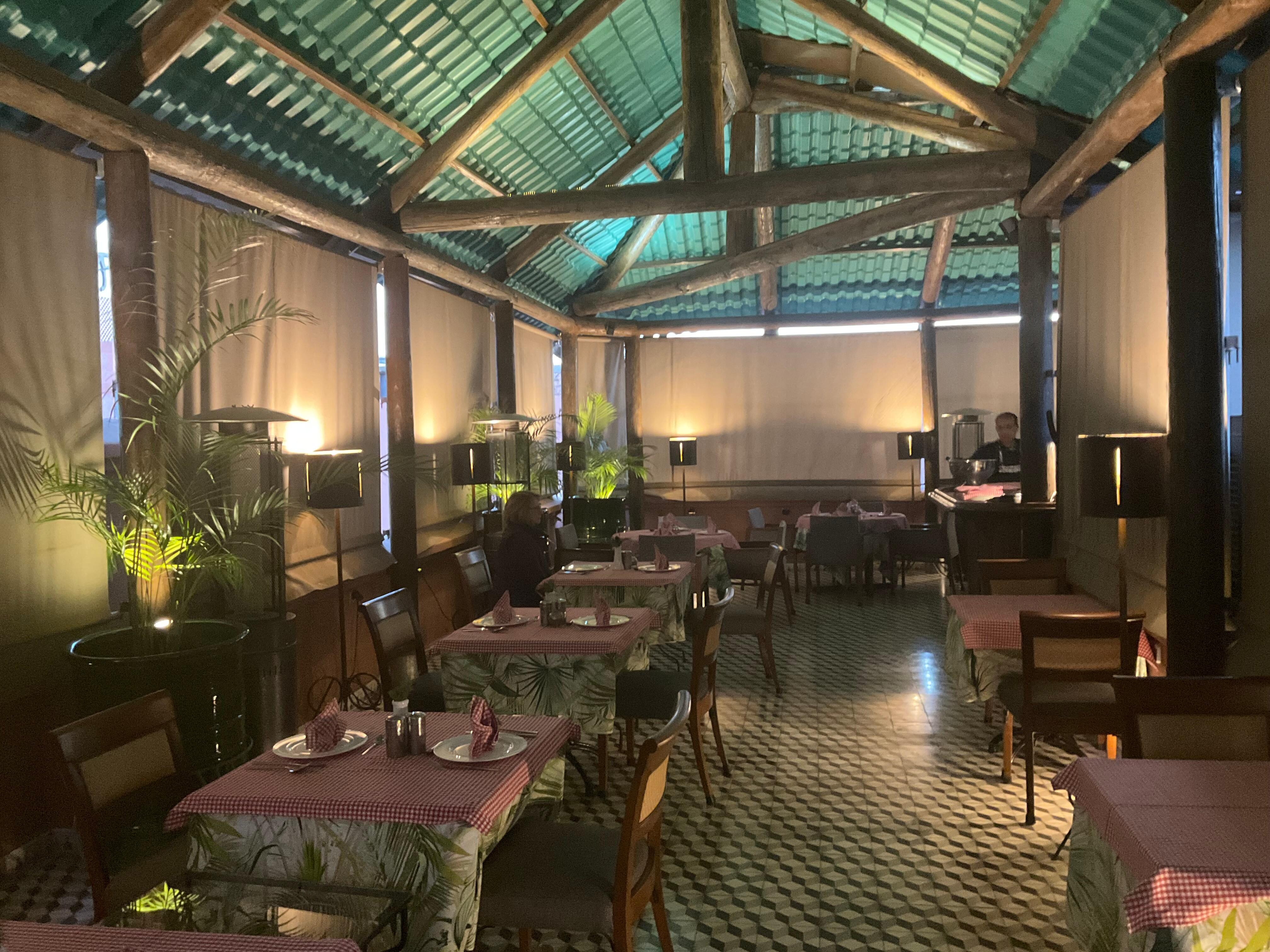 rooftop restaurant 
with shades drawn