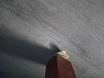 Cardboard under dresser leg.