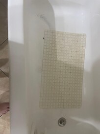 The tub conveniently covered up with a mat almost broke a foot