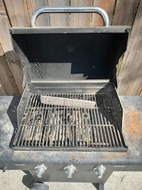 It's a gas grill but someone put charcoal in it.