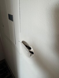 Patch on the wall that was falling off in the bedroom