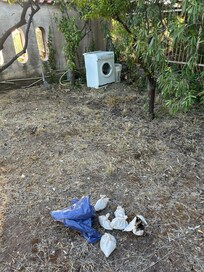 Discarded appliances, my dog used this area for relief since I was already dirt filled